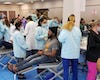 Patients in row of dental treatment chairs at community event