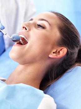 A female patient having her teeth checked