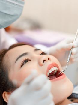 A female patient having her teeth checked