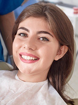 Smiling woman in dental chair