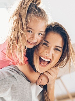 Smiling mother and daughter