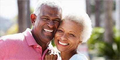 Smiling senior man and woman outdoors