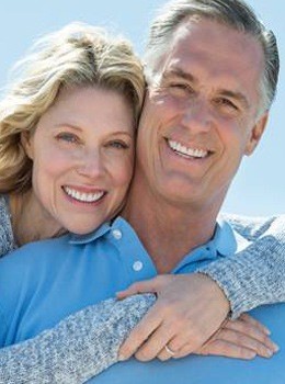 Man and woman smiling outdoors