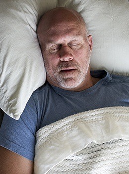 Man sleeping soundly in bed