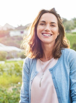 Woman smiling outdoors