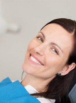 Woman in dental chair smiling